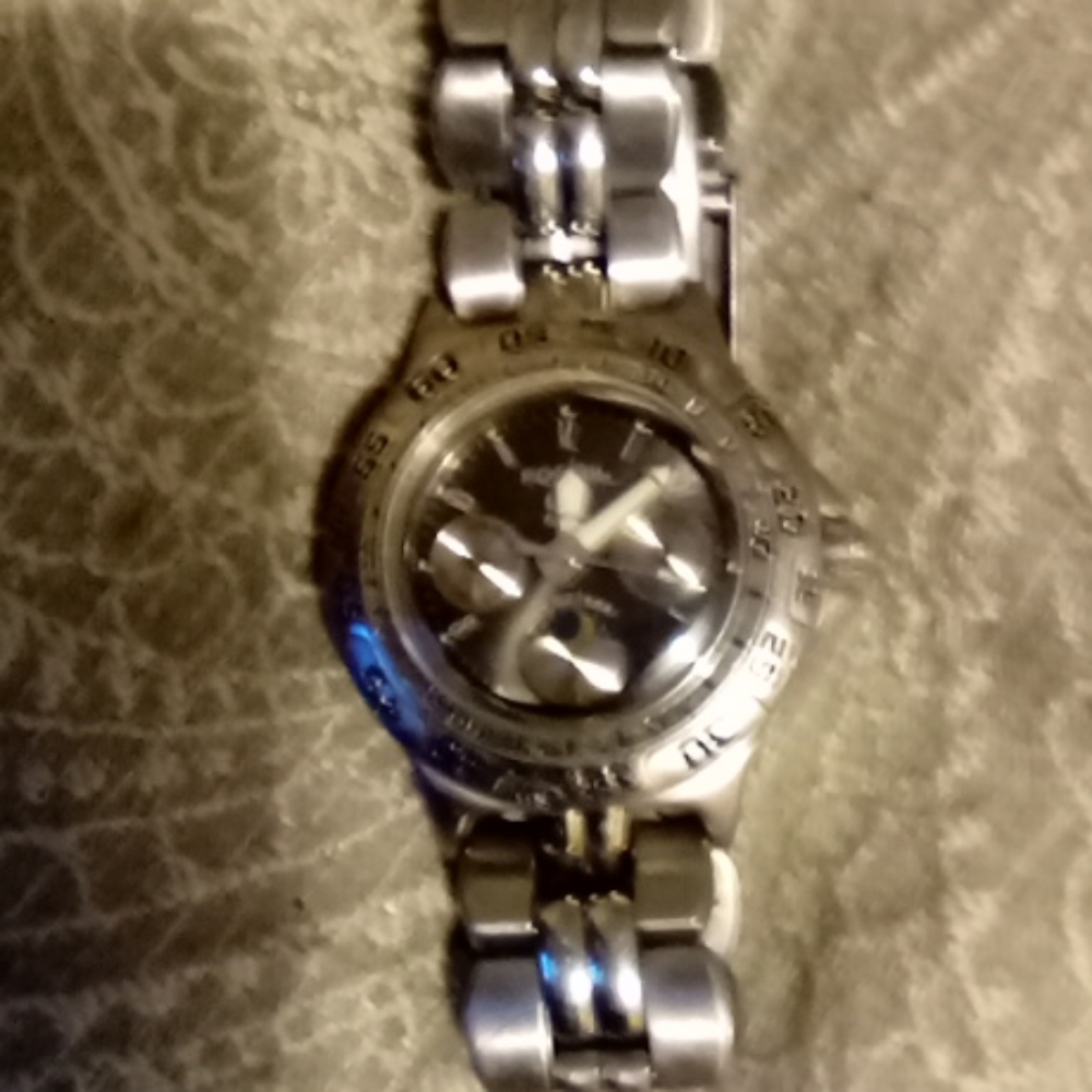 Wemon's Fossil wrist watch with three Sub dials.